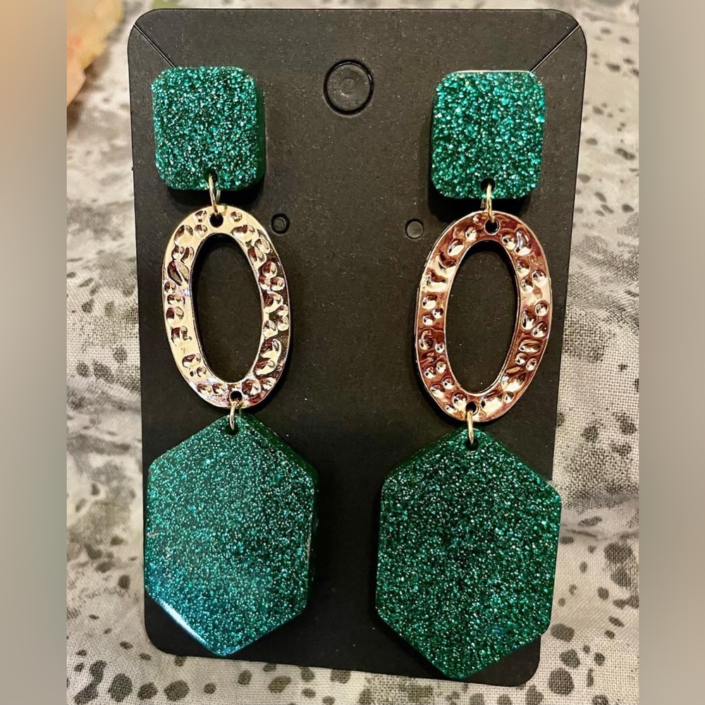 Handmade resin art. Including earrings, necklaces, pins, coasters etc